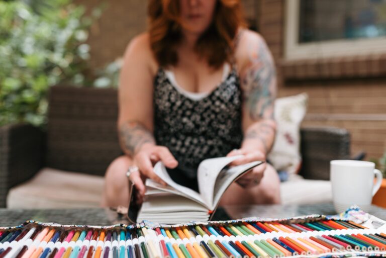 woman looking through notebook