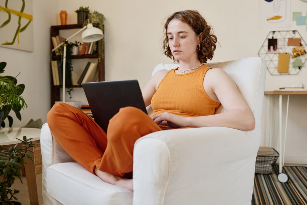 woman in orange on a zoom call