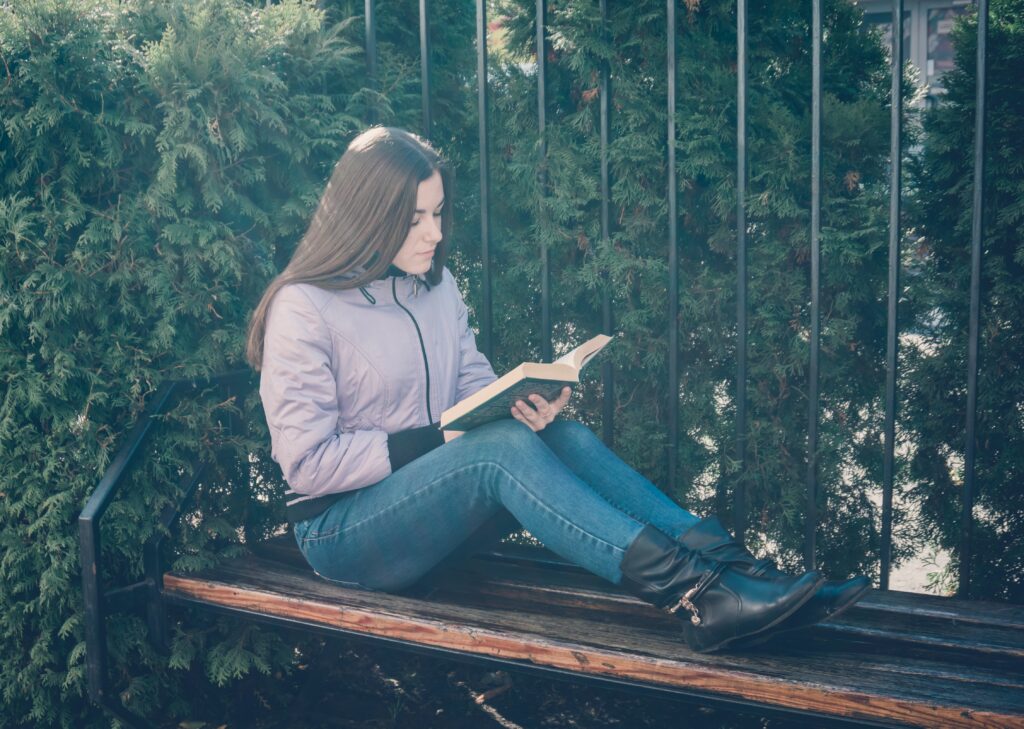 teen girl  reading a book