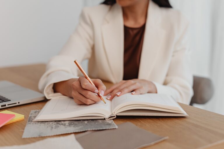 woman writing her goals down