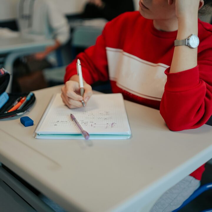 A high school student is focusing in class.