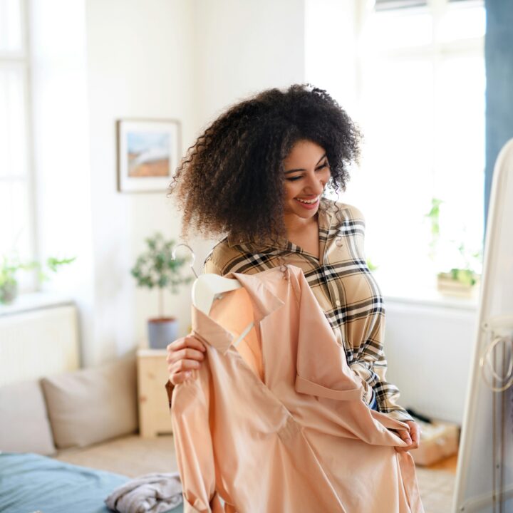 woman admiring clothes in the mirror