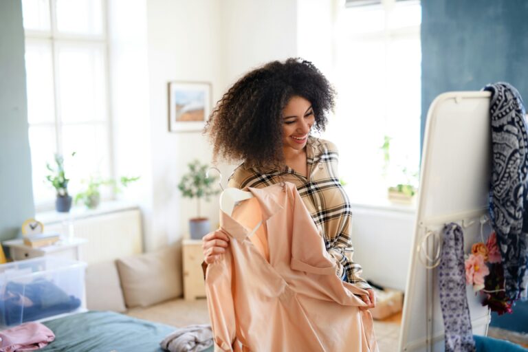 woman admiring clothes in the mirror