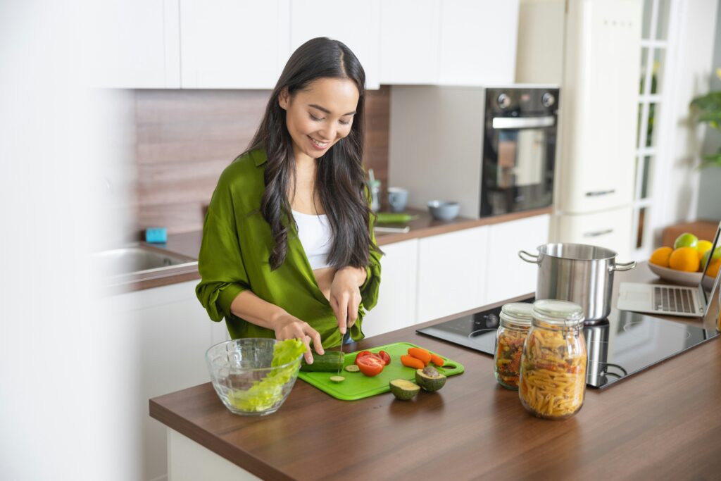 a woman meal prepping in her kitchen