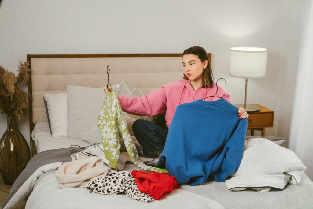 a woman cleaning out her closet