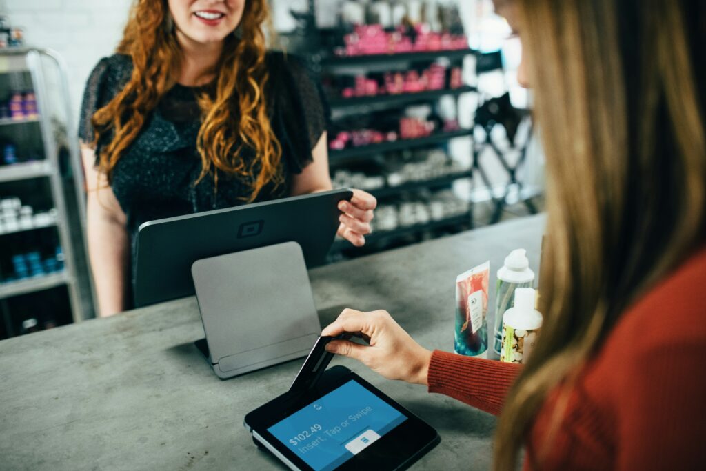 woman shopping and paying by card