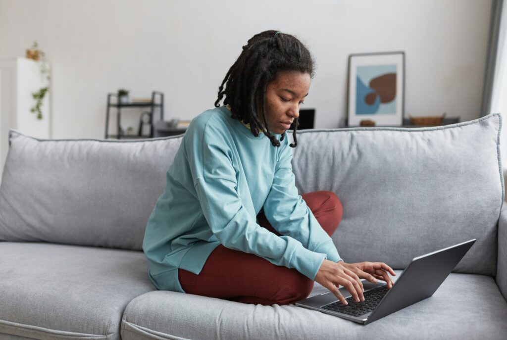 woman checks her finances on her computer