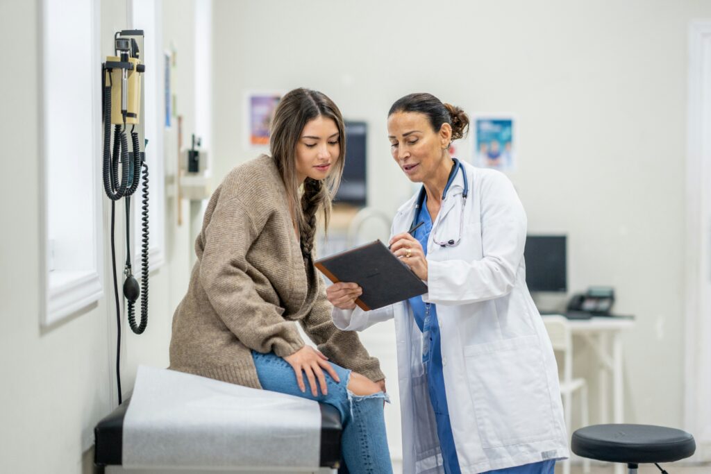 woman discussing concerns with her doctor