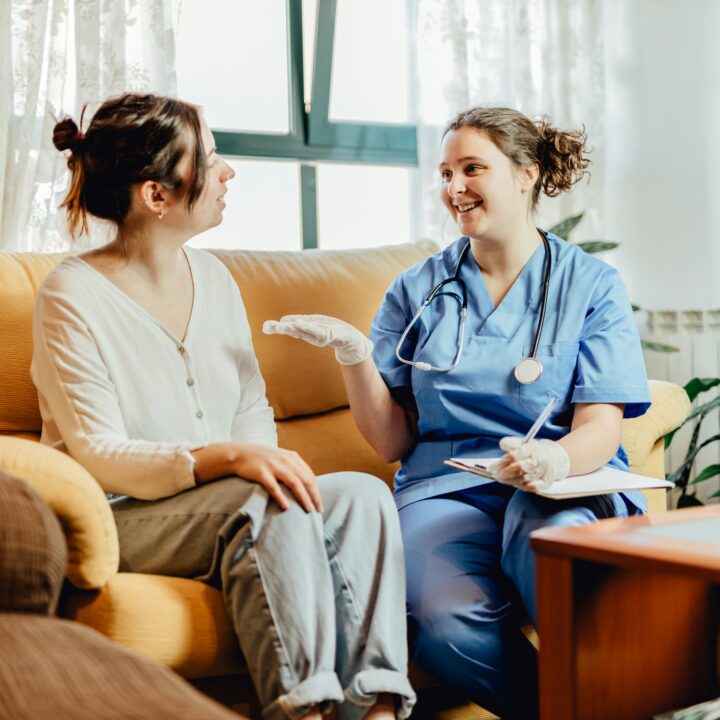 nurse talking talking to a patient