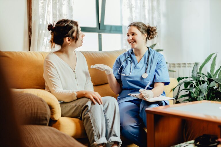 nurse talking talking to a patient