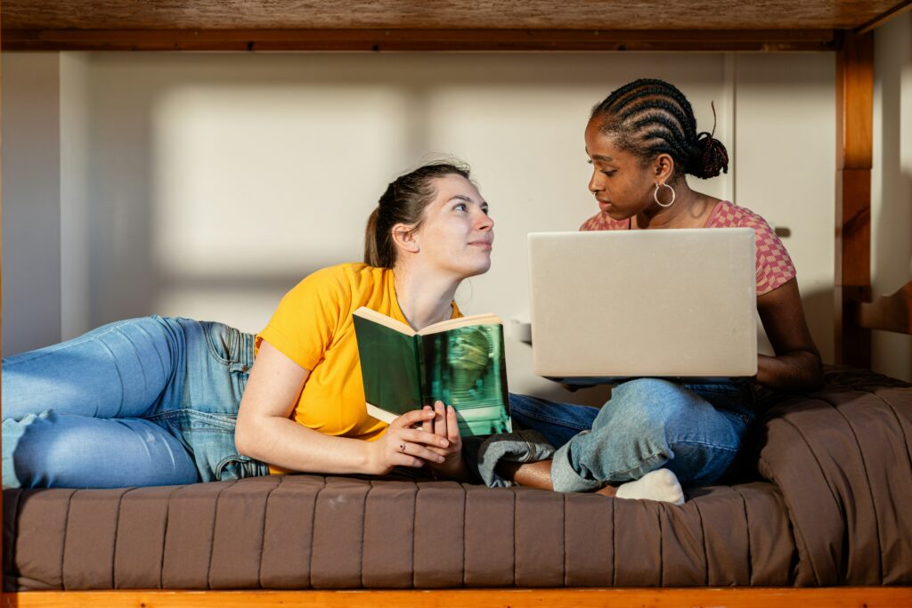 friends discovering a book together and sharing connection