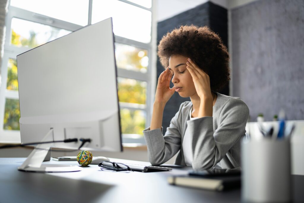 a woman burning out at work due to lack of sleep