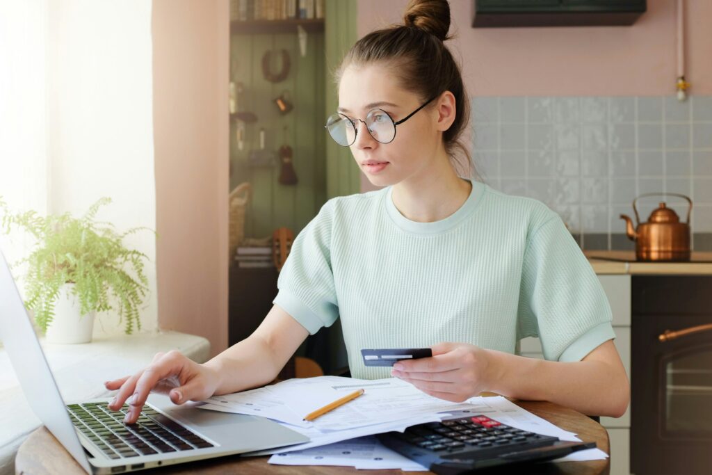 young woman checks her bank account and other statements