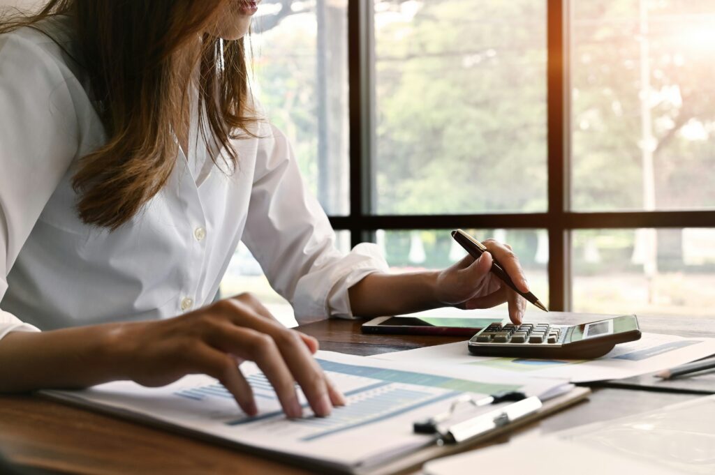 a woman working on her finances to get out of debt