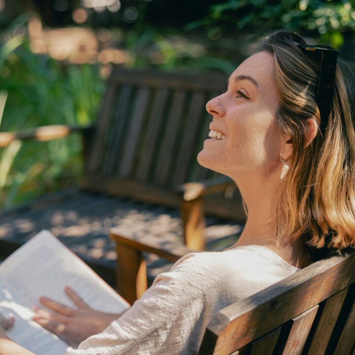 woman with a book in the garden