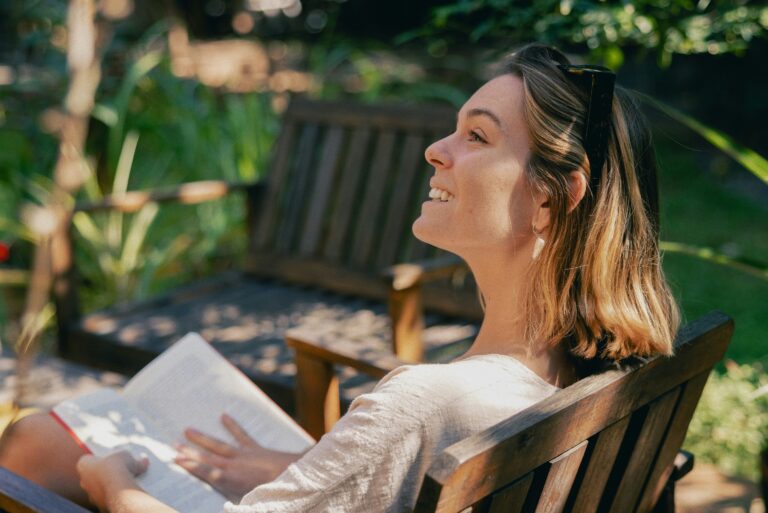 woman with a book in the garden