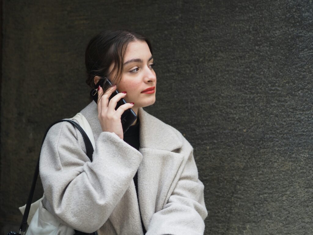 young woman discussing plans on the phone