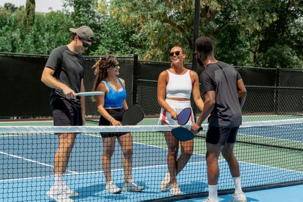 A group of friends playing pickle ball