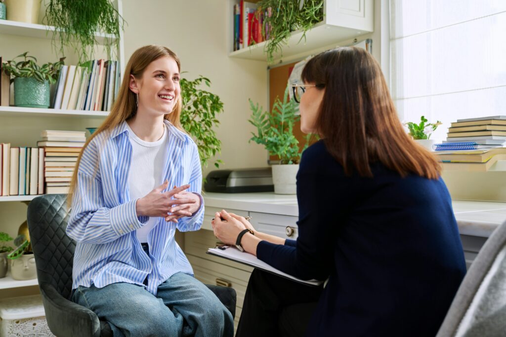 young woman speaking with her therapist
