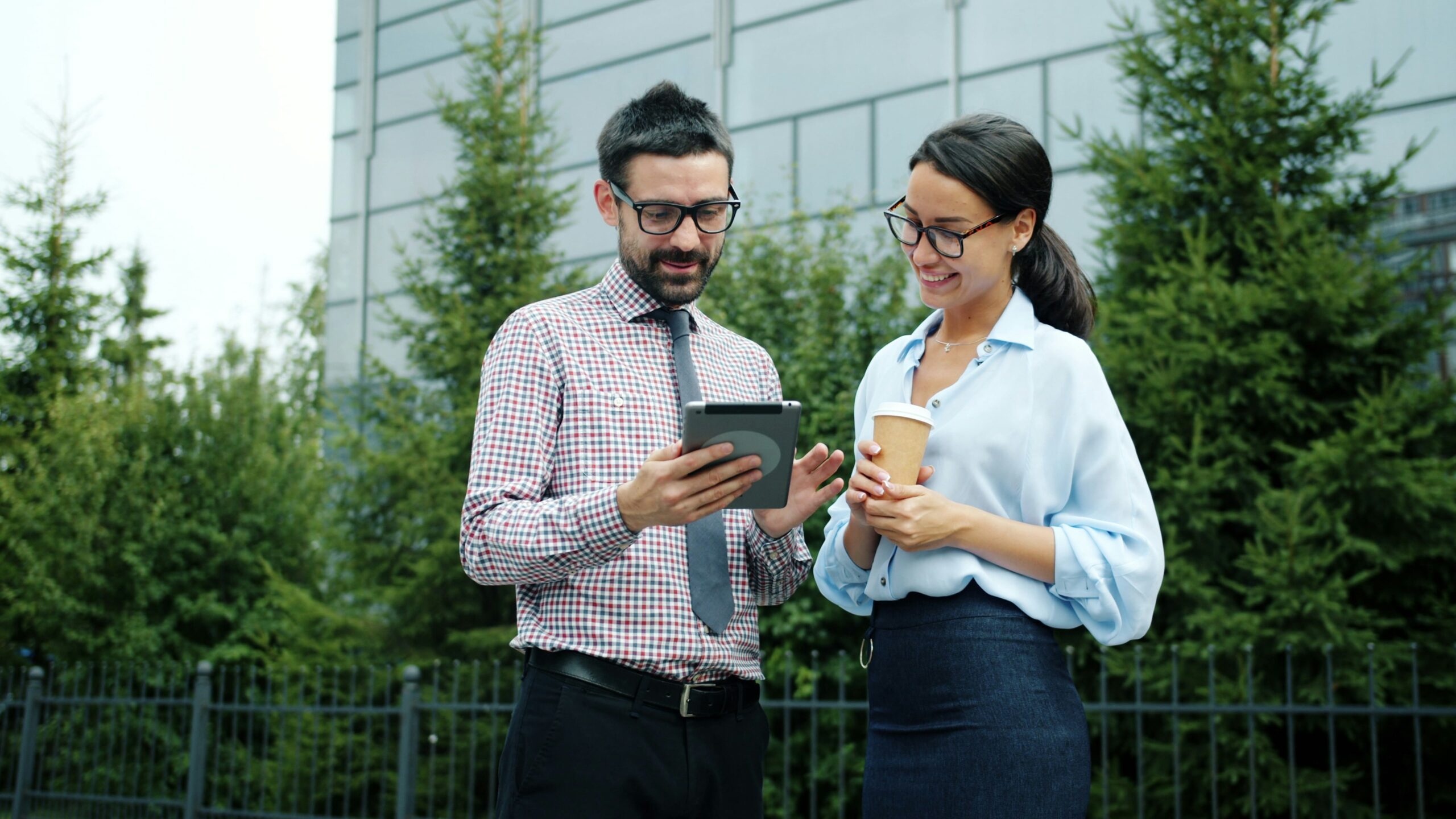 business man and woman have a discussion outside