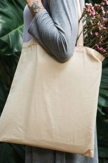 woman carrying a tote bag