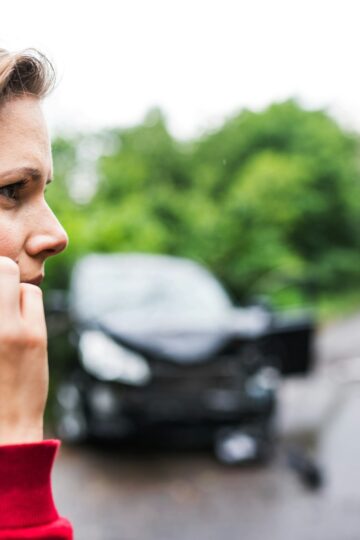 woman on the phone after a car accident