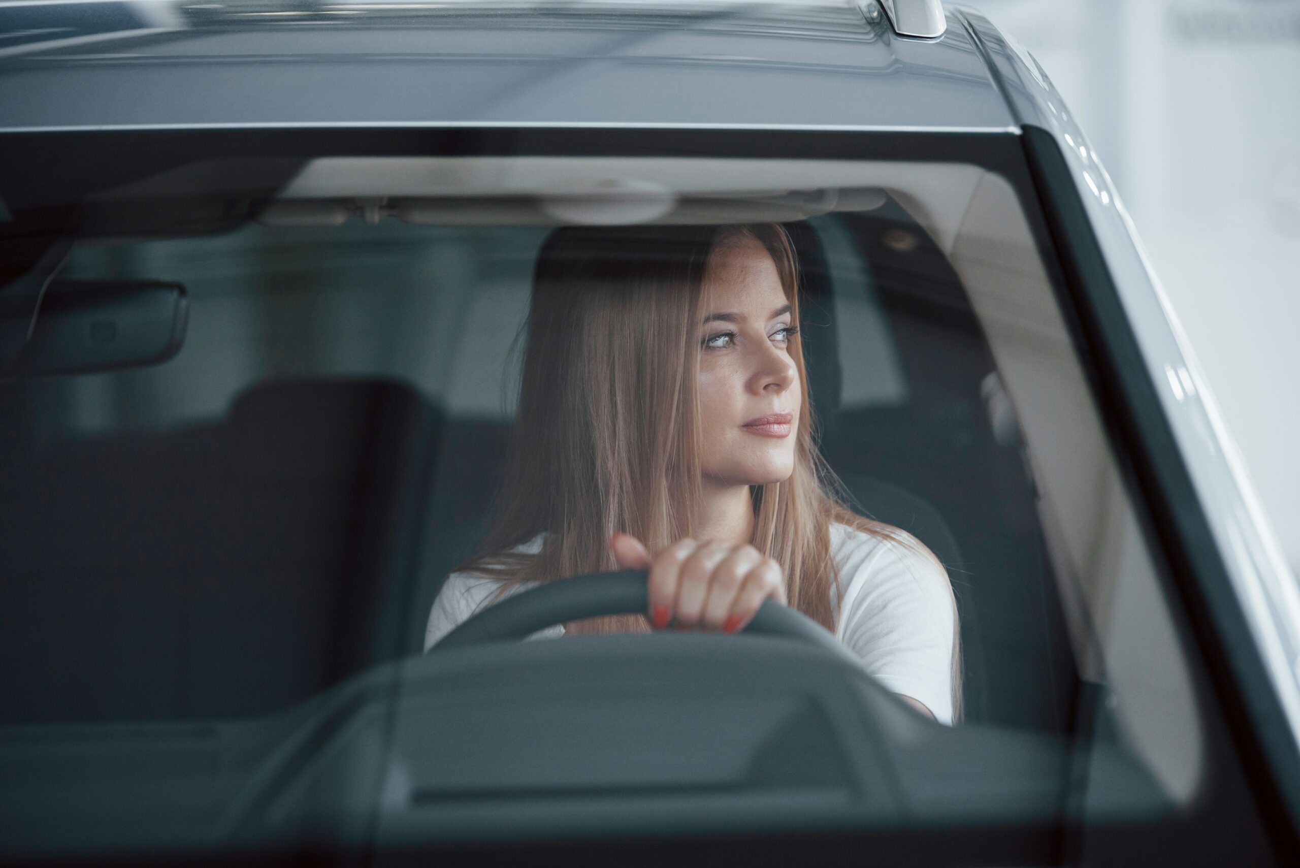 young woman drives home from work to reset after a 12 hour nursing shift